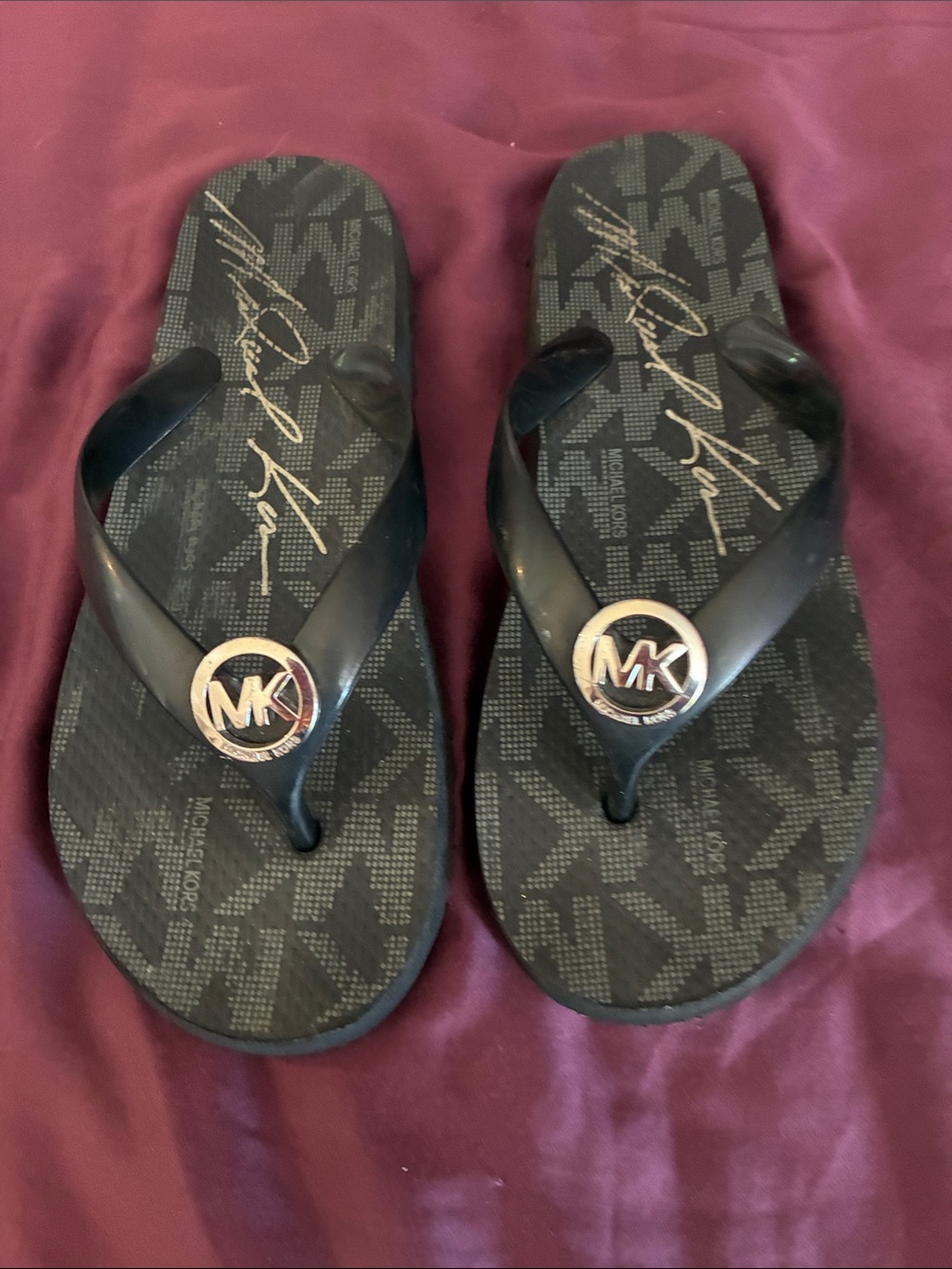 Michael Kors women’s Black Logo MK Medallion Flip Flops